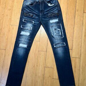 "Ubuntu Revolution" dark blue faded jeans.